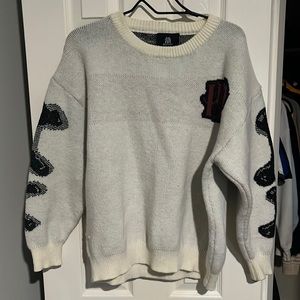 White and black sweater